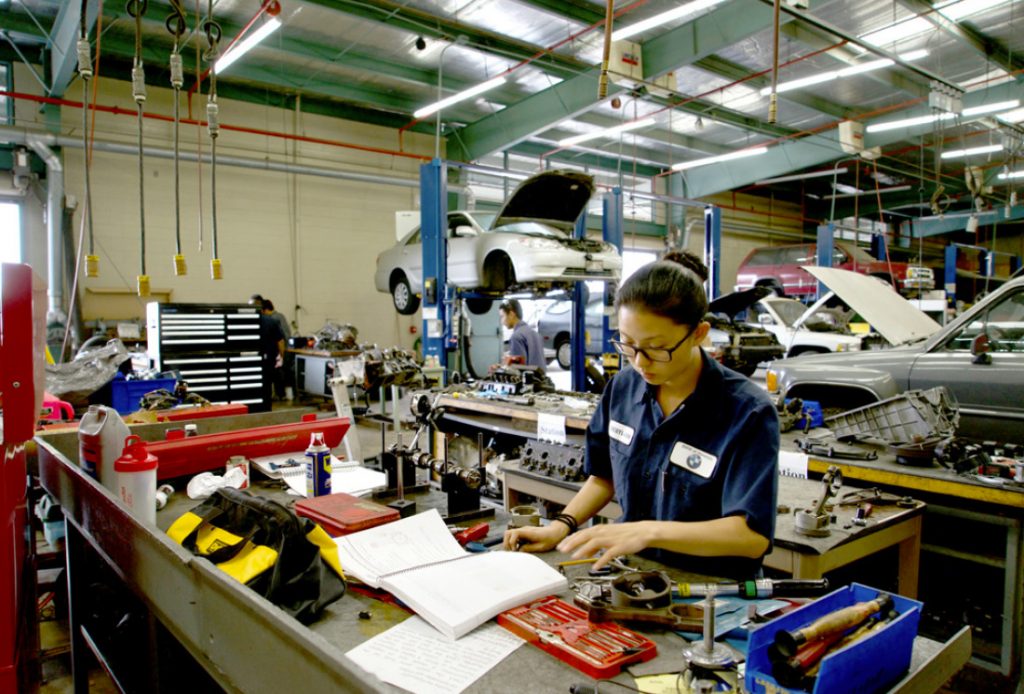 Student working in automotive facility